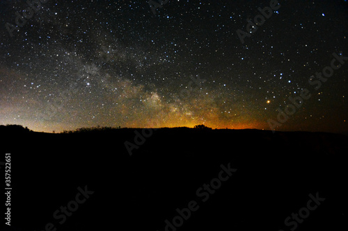The Milky Way rising over cliffs at Blackgang Chine, Isle of Wight, UK.