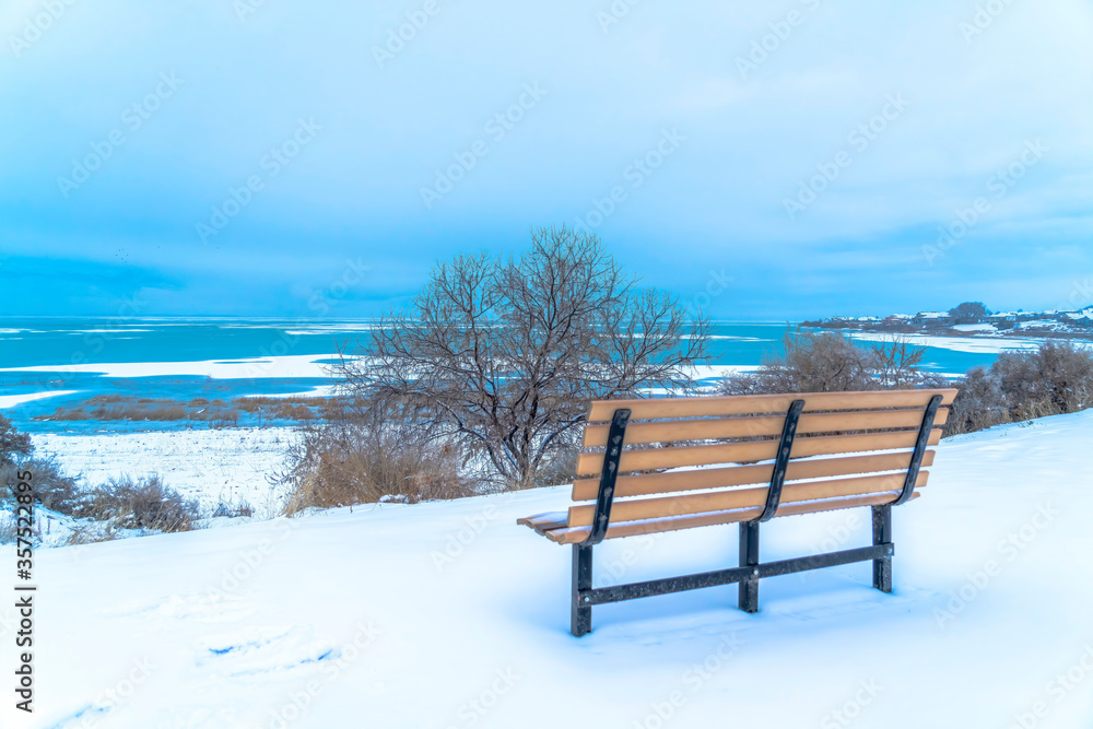 Beautiful Utah Lake in winter against overcast sky viewed from an outdoor bench
