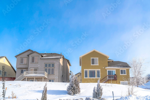 Facade of homes that sit on the snow covered slope of Wasatch Mountain in winter