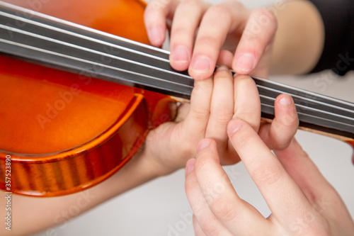 music school, teaching children to play the violin