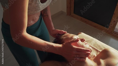 Wallpaper Mural Caucasian girl therapist making facial massage on woman face Torontodigital.ca