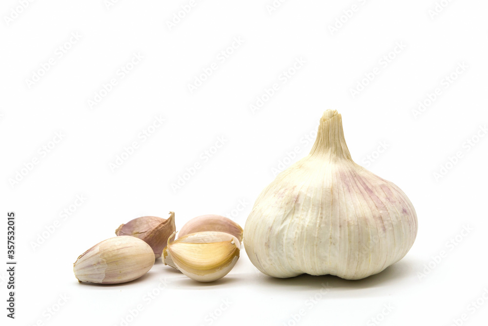 Close up raw garlic with segments isolated on white background