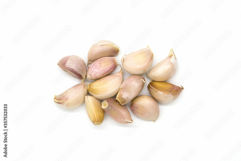 Close up raw garlic with segments on white background Close up raw garlic with segments on white background