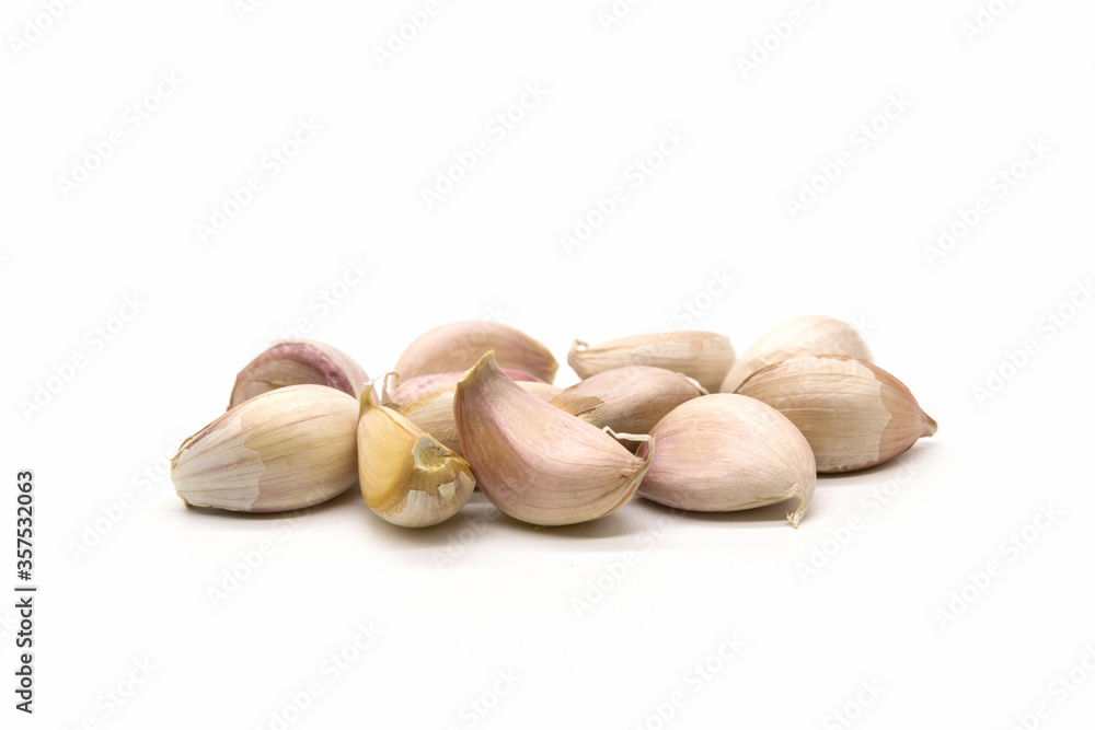 Close up raw garlic with segments on white background Close up raw garlic with segments on white background
