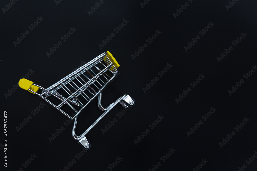 Shopping cart or trolley on black background