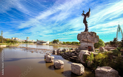 Keeper of the plains Sculpture in dramatic background in Wichita Kansas photo