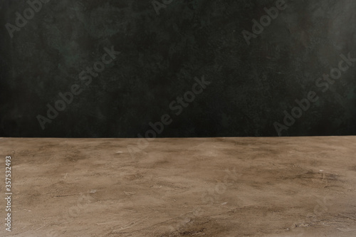 Image of textural table in front of abstract blurred background. Empty textural table platform over background for present product. Copy space.