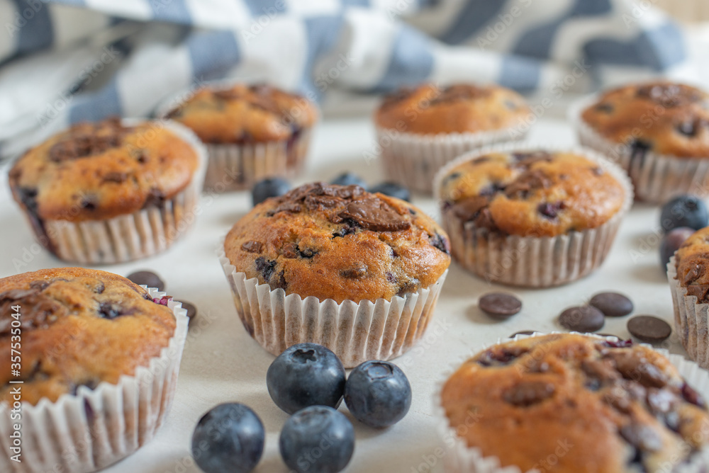 sweet home made chocolate blueberry muffins on a table sweet home made chocolate blueberry muffins on a table