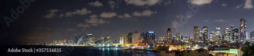 Panoramic view at night. Seascape and skyscrapers on background in Tel Aviv  Israel.