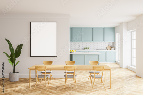 Whte and blue kitchen with table and poster