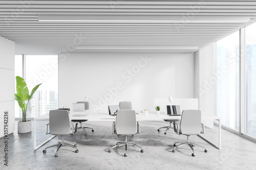 Workplace in white loft office © ImageFlow