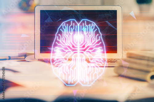 Double exposure of work space with computer and human brain drawing hologram. Brainstorm concept.