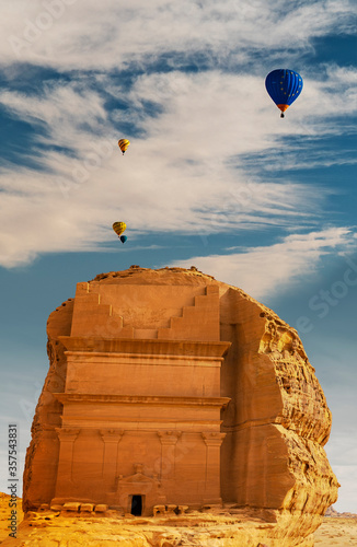 Tomb of Lihyan (Qasr AlFarid) at Mada'in Saleh during the Tantora Balloon Festival in Al Ula, Saudi Arabia photo