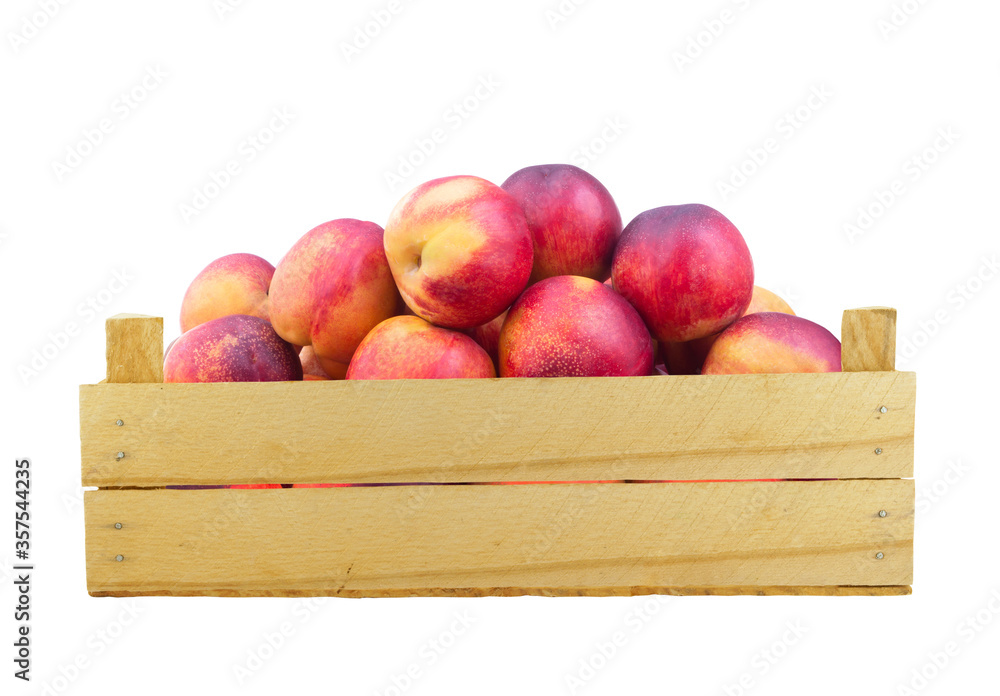 Fresh ripe nectarines in wooden box isolated on white background Fresh ripe nectarines in wooden box isolated on white background