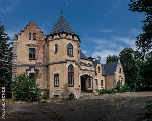 Beautiful old abandoned castle under a blue sky