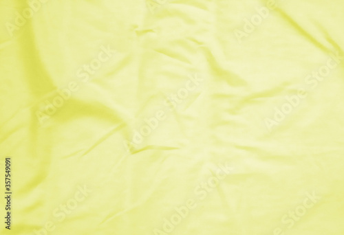 Crumpled yellow fabric background. abstract background.