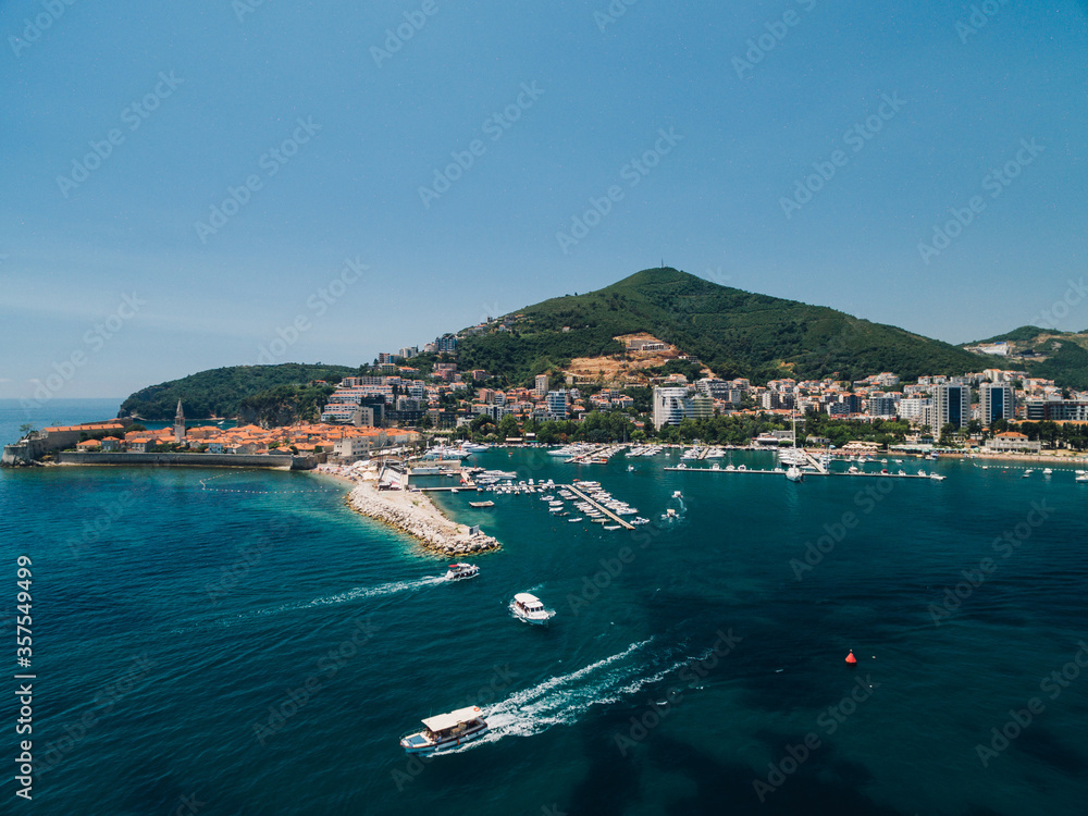 Boat dock and yacht port in Budva, Montenegro. Aerial photo from the drone.