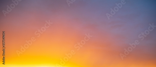 Colorful clouds at sunset as a background. © schankz