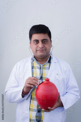 Photography Portrait of a self assured doctor with a stethoscope.