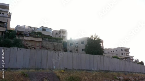 Palestine Refugges Camp Behind Concrete wall -aerial
Dolly shot,Anata,Jerusalem,June,2020
 photo