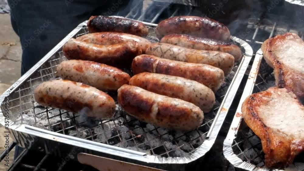 Details of a family barbecue witrh burgers, sausages, steak and pork. Details of a family barbecue witrh burgers, sausages, steak and pork.