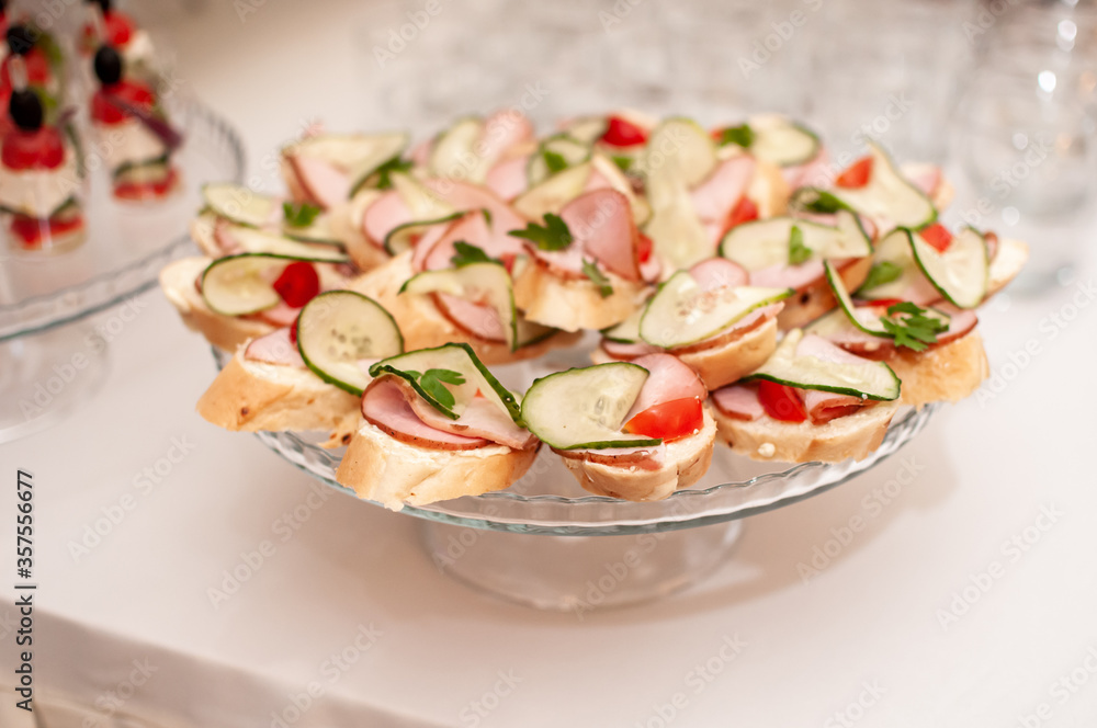 canapes with ham, fresh cucumber and cherry
