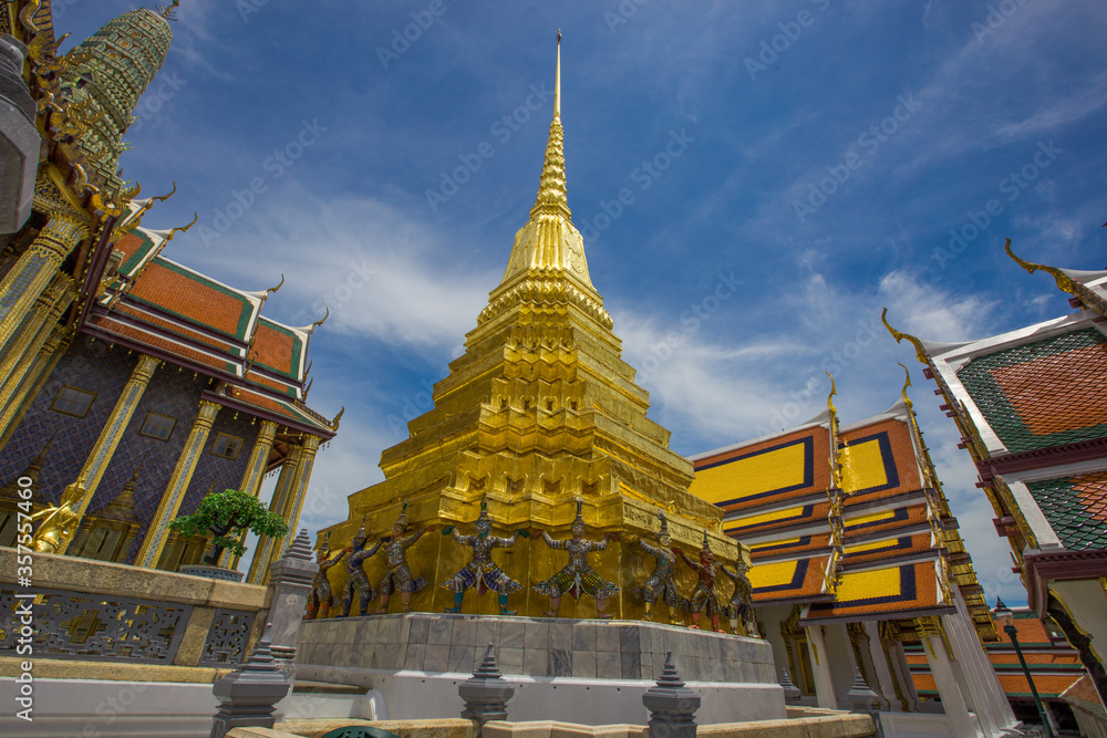 Fototapeta premium Temple of the Emerald Buddha - Wat Phra Si Rattana Satsadaram / Wat Phra Kaew-Bangkok: June 13, 2020, tourists visit to see the beauty of The Grand Palace, in Phra Nakhon District, Thailand.