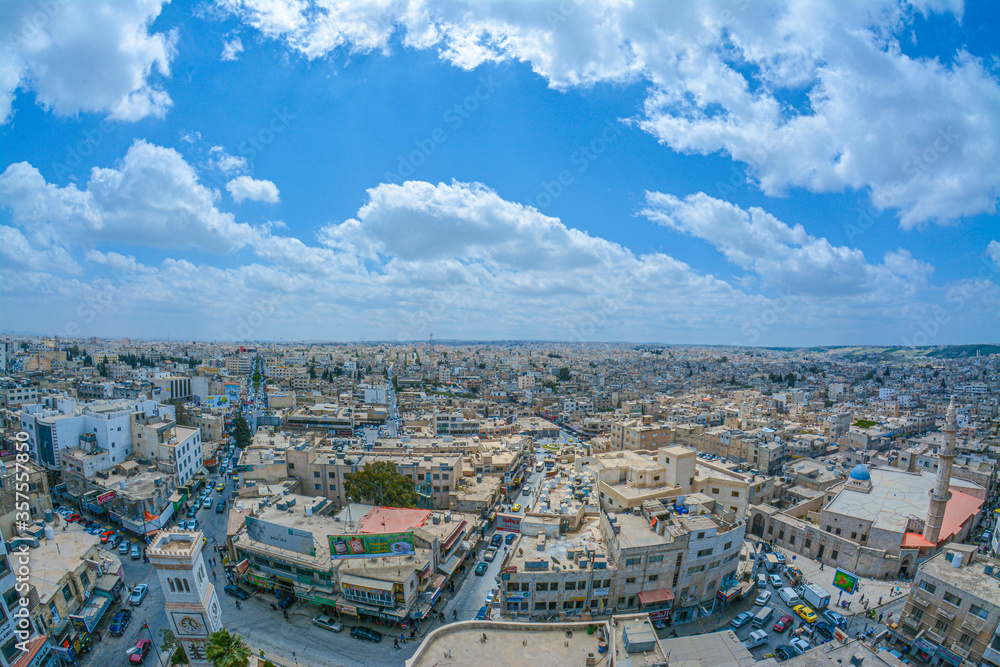 Irbid  in ancient times as Arabella or Arbela , is the capital and largest city of the Irbid Governorate. It also has the second largest metropolitan population in Jordan after Amman, with a populatio