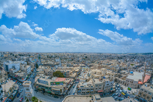 Irbid  in ancient times as Arabella or Arbela , is the capital and largest city of the Irbid Governorate. It also has the second largest metropolitan population in Jordan after Amman, with a populatio photo