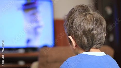 Little boy watching cartoon on tv