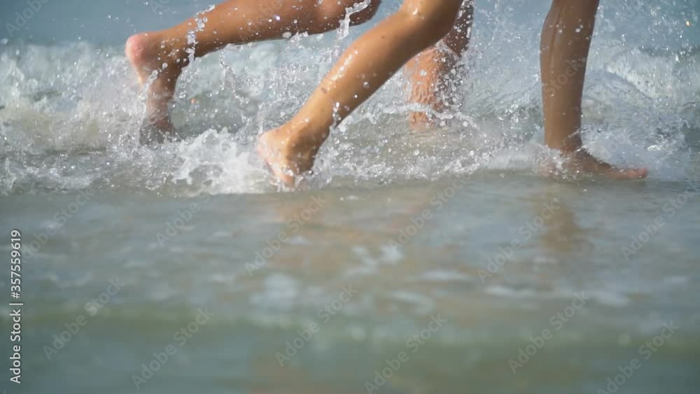 mom and daughter are playing in the sea mom and daughter are playing in the sea