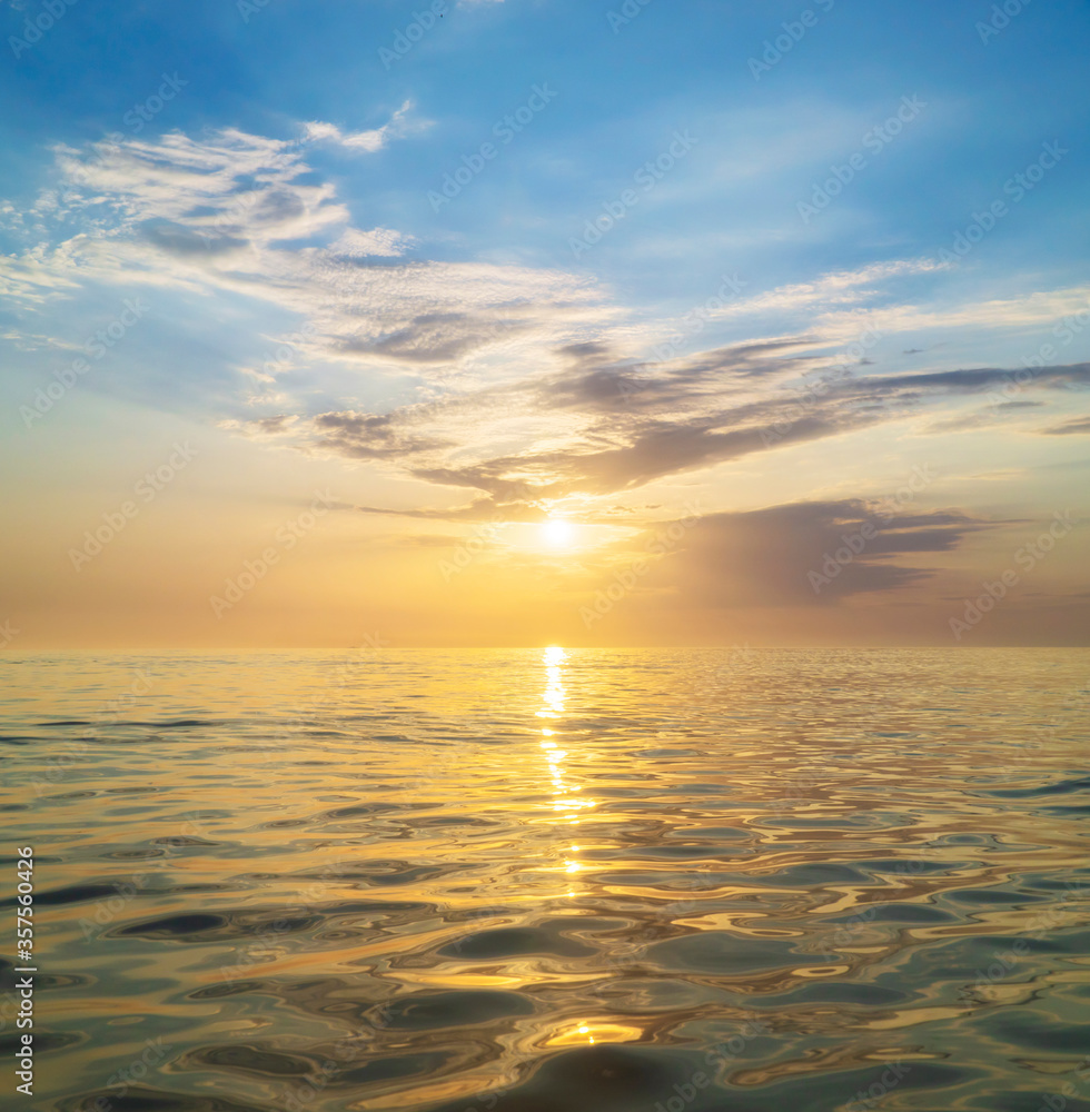 Sun and golden sea sunset surface background.