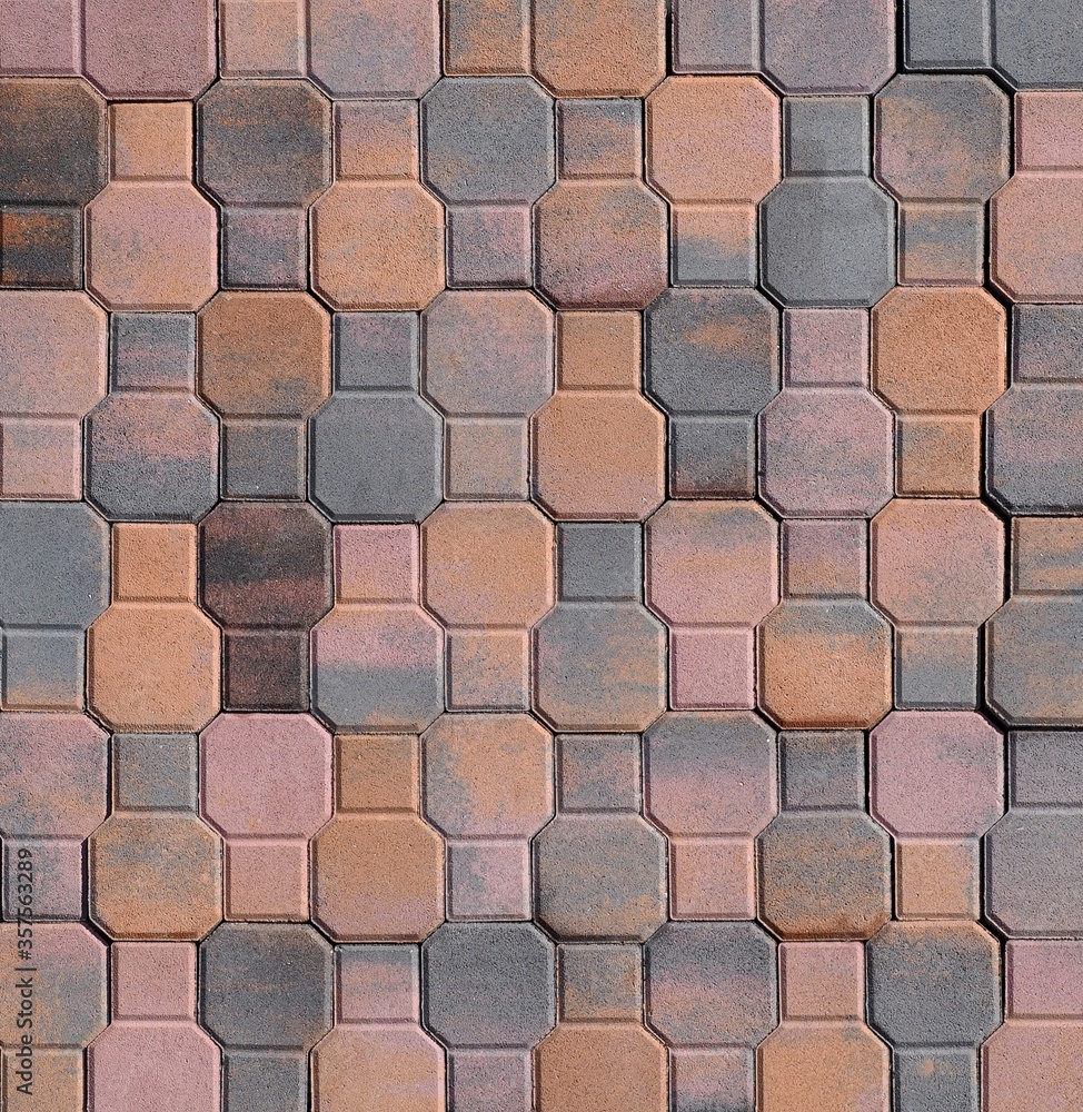 Tiles for outdoor floorings and pavement made in the shape of octagons and squares .Colors are pink, brown, orange and gray. Tiles for outdoor floorings and pavement made in the shape of octagons and squares .Colors are pink, brown, orange and gray.