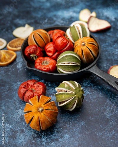 Beautiful food portrait of Wnter seasonal dried fruits with old vintage texture background and cutlery and accessories
