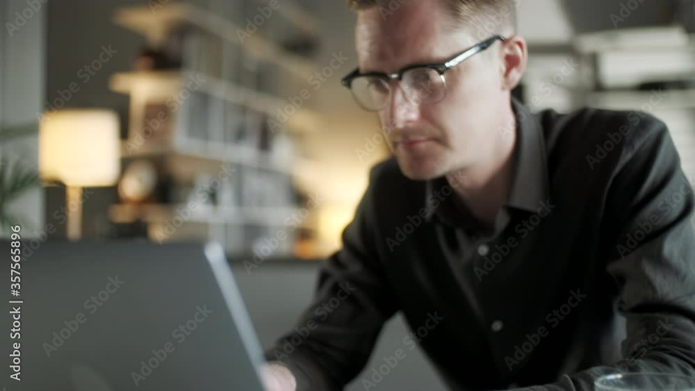 Young Man Freelancer Using Laptop Online Working From Office In Internet, Smiling Focused Millennial Guy Searching On Computer Surfing Web Looking At Screen Enjoying Distant Job Young Man Freelancer Using Laptop Online Working From Office In Internet, Smiling Focused Millennial Guy Searching On Computer Surfing Web Looking At Screen Enjoying Distant Job