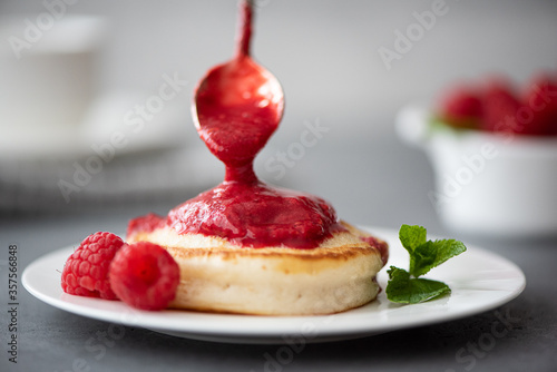 hot pancakes sprinkled with raspberry jam photo