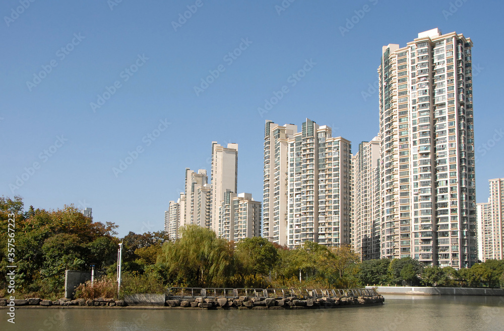 Modern residential tower blocks in Shanghai, China. These high rise buildings are typical of residential buildings in Shanghai where most people live in apartments. Area near Shanghai Railway Station.