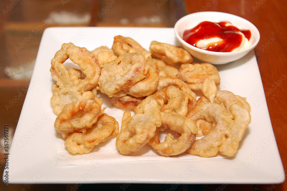 Fried calamares squid rings with ketchup and mayonnaise dip Fried calamares squid rings with ketchup and mayonnaise dip