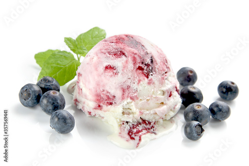 Ice cream scoop with blueberries isolated over white photo