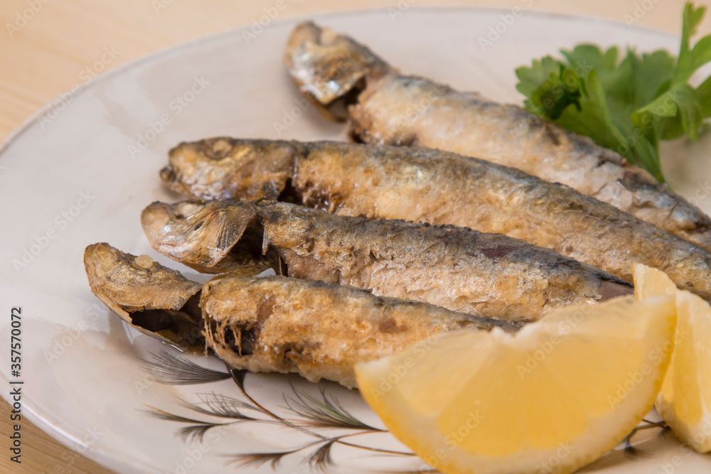 roasted fish, sardines or anchovies with lemon