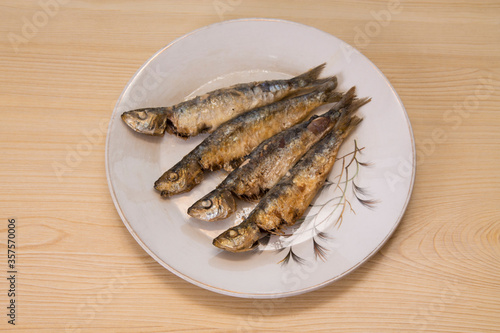 roasted or fried sardines on the plate