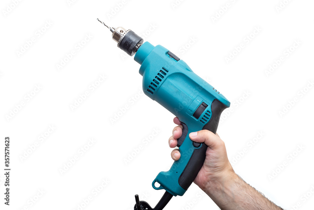Men's hands hold a drill on a light background Men's hands hold a drill on a light background