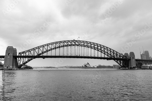 Black and white panoramic picture of the Harbour bridge and Sydney Opera house. View from the public ferry boat. Sydney, Australia © Alba