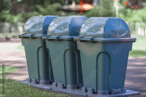 Blurred background of New design waste bins, available for disposal according to the type of waste in public gardens or on the road, for good sanitation.