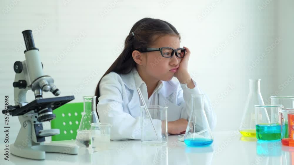 Asian girl kid thinking Formula science idea and inspiration innovation technology of world in education. Asian girl kid thinking Formula science idea and inspiration innovation technology of world in education.
