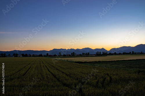 sunset over the field, Beautiful mountain view morning light, Alps.
