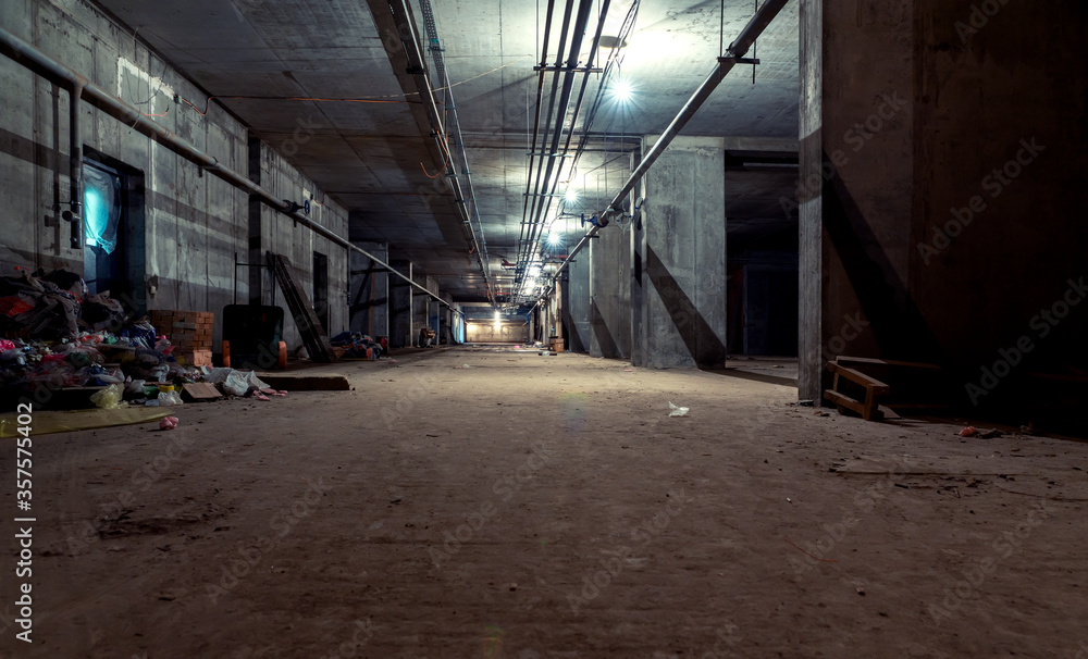 Fotografie Gloomy concrete basement in an industrial building