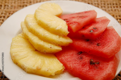 Watermelon and pineapple on plate serve in hotel resort