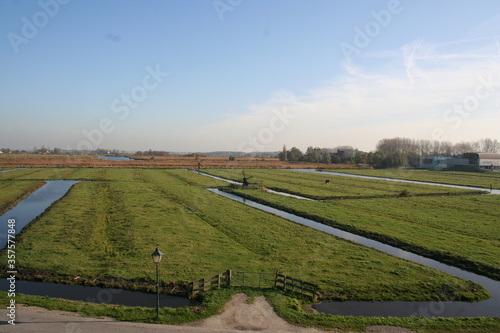 Polder landscape in the Netherlands with mills.