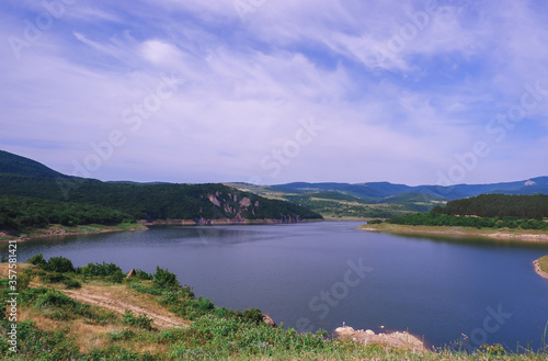 Clear blue lake and mountains around © Ekaterina